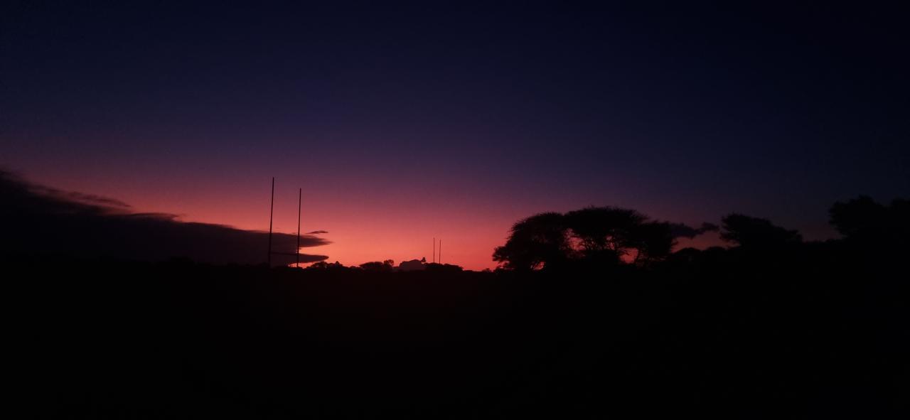 Learners at Jubaweni during a warm outdoor sunset